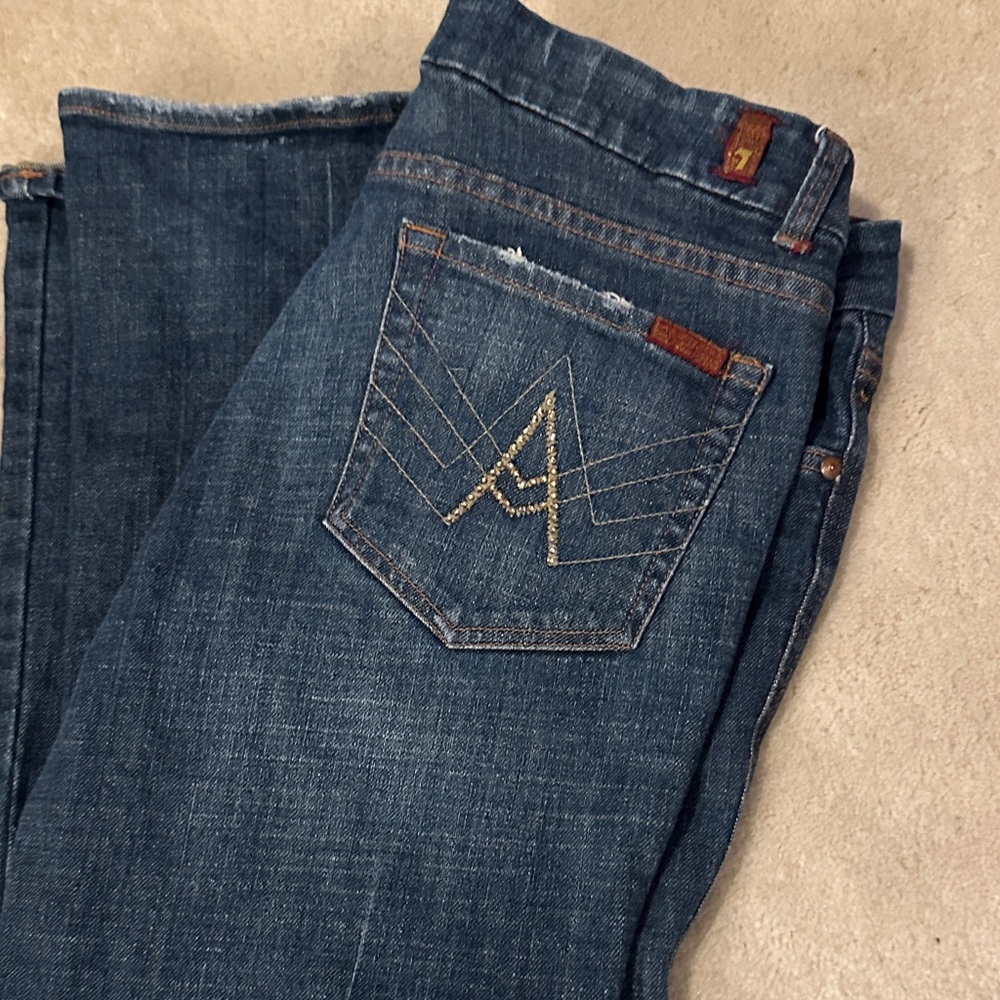 7 for all mankind “A”. dark wash boot cut jeans